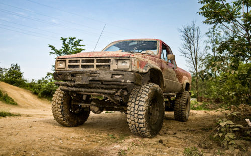 Lifted pickup with big tires after mud bogging
