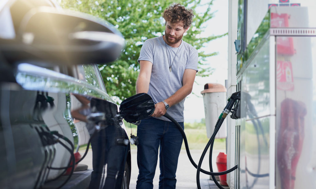 Man fueling up his vehicle at the pump
