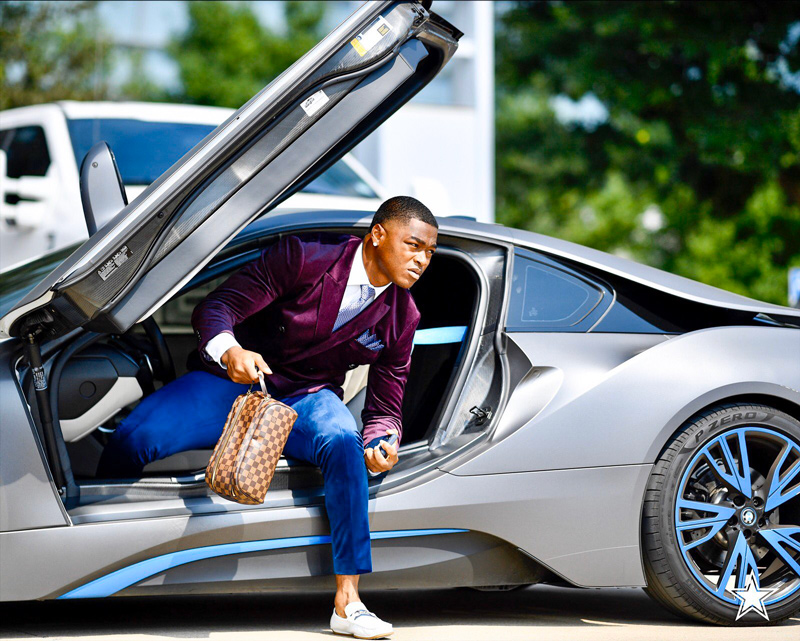 Dallas Cowboys' Amari Cooper getting out of his BMW i8