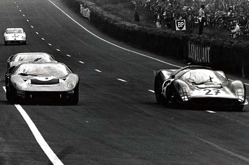 Ford GT40 racing alongside Ferrari 330 in 1966 24 hours of Le Mans