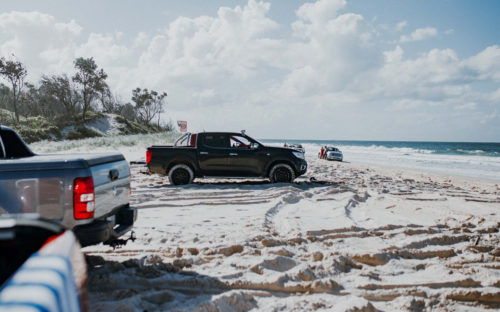 AWD vehicles on sandy beach