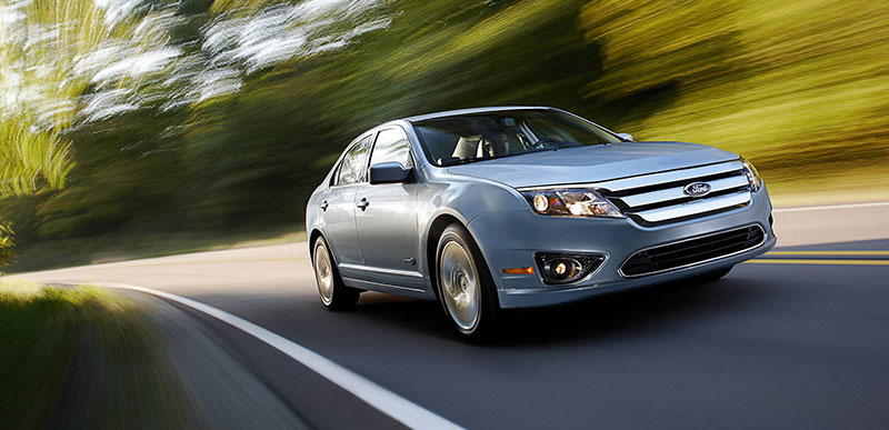 Man driving silver Fusion Hybrid