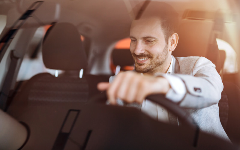 A car shopper checking out a new vehicle A car shopper checking out a new vehicle