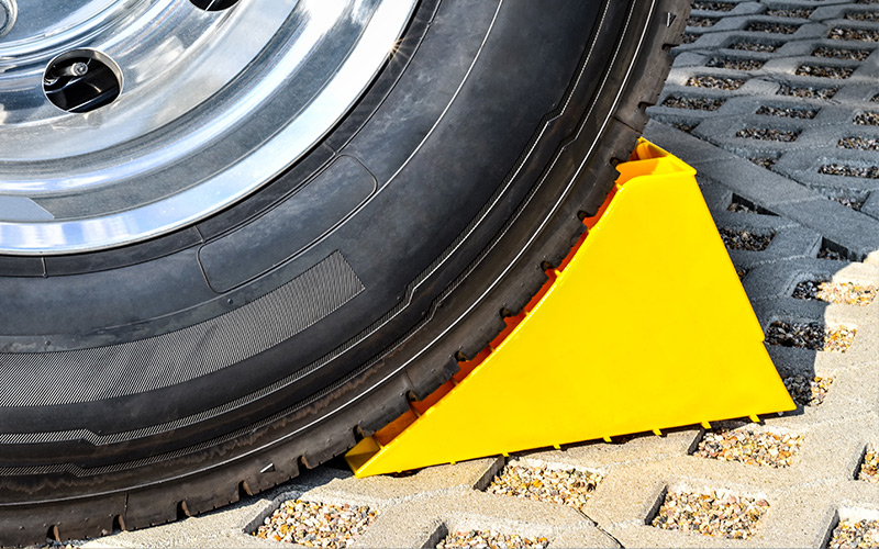 Vehicle utilizing a parking chock Vehicle utilizing a parking chock