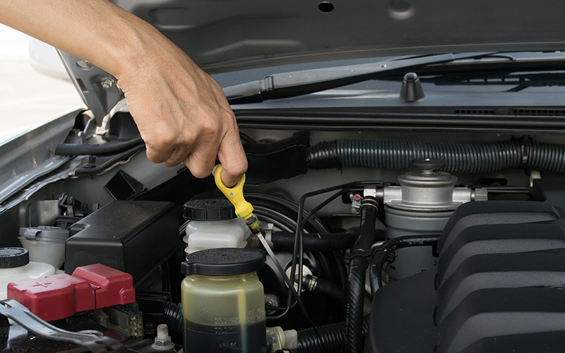 Checking vehicle fluids for needed maintenance Checking vehicle fluids for needed maintenance