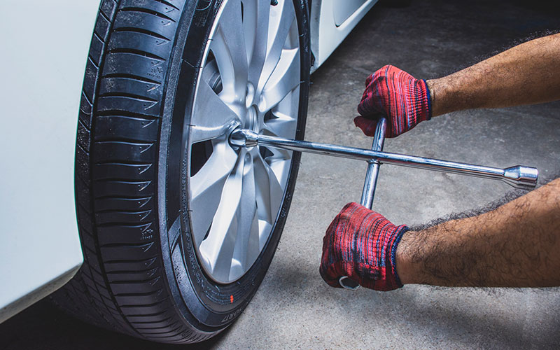 Placing tire back onto vehicle