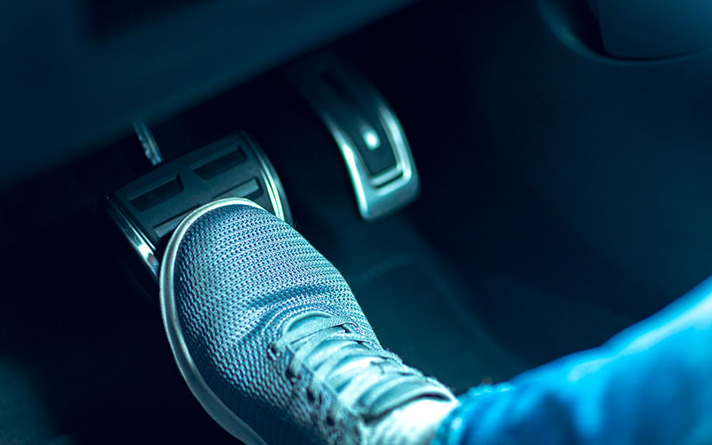 Driver's foot on the brake pedal