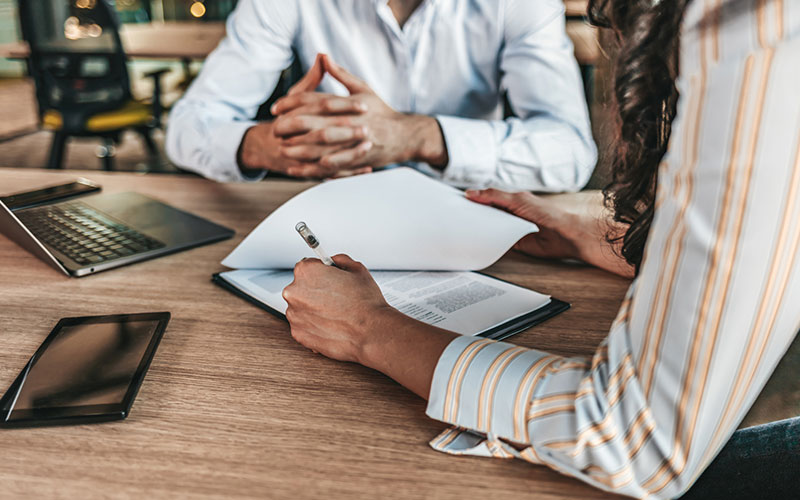 Person reading through paperwork