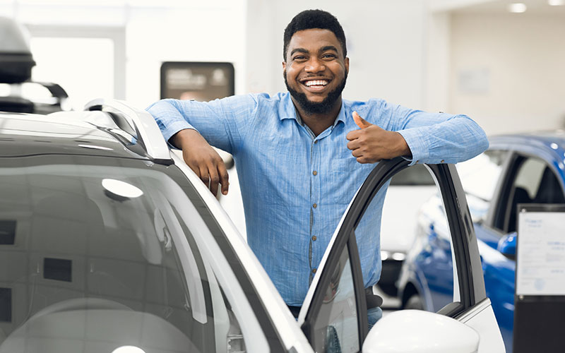 Happy customer with a new vehicle