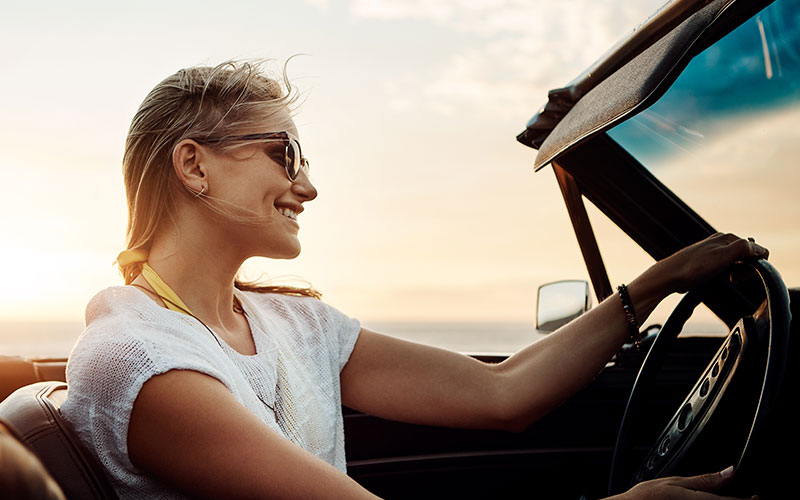 Woman driving a convertible