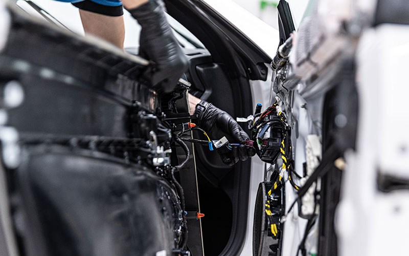 Car speakers being professionally worked on