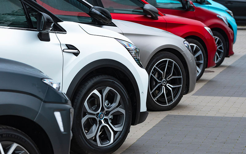 Vehicles parked in a dealership lot Vehicles parked in a dealership lot