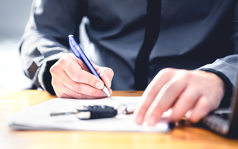 Customer signing paperwork Customer signing paperwork