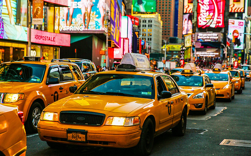 Taxis on a city block