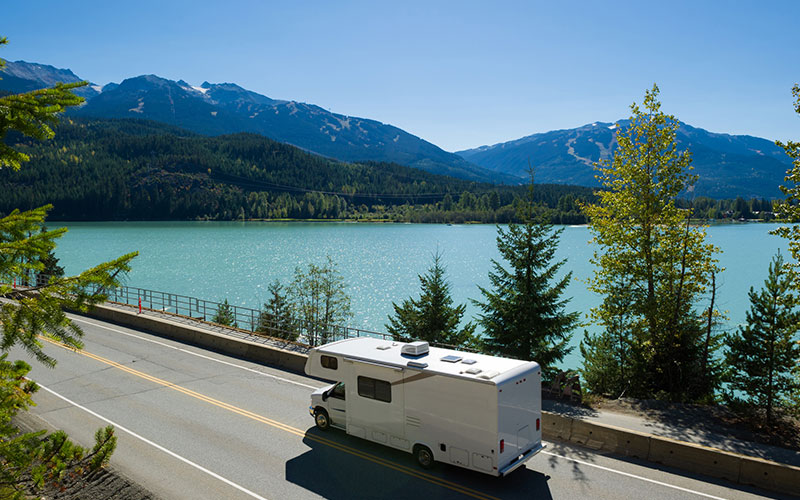 Camper driving through the mountains Camper driving through the mountains