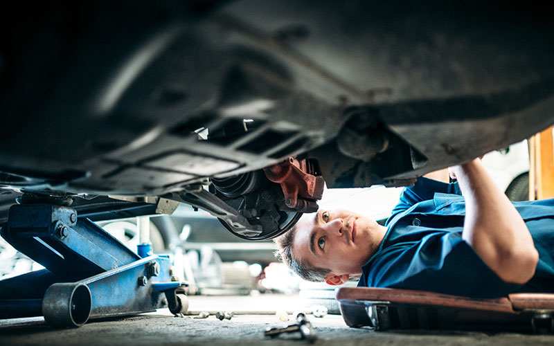 Working on a lifted car
