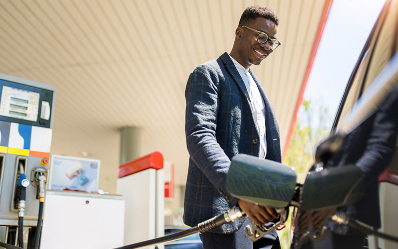 Man fueling up his car
