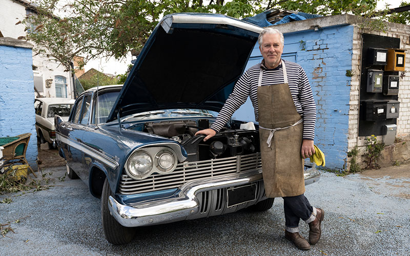 Man restoring a classic car