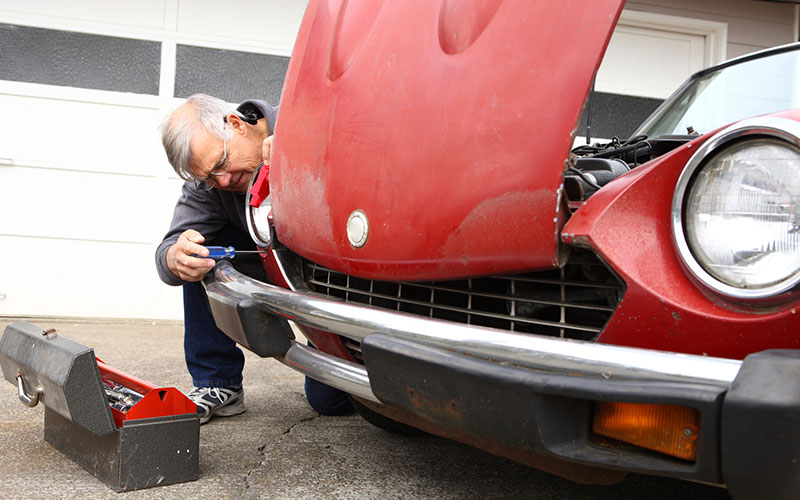 Man working on a classic car