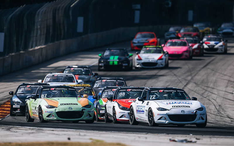 Miatas racing at an MX-5 Cup event - mx-5cup.com