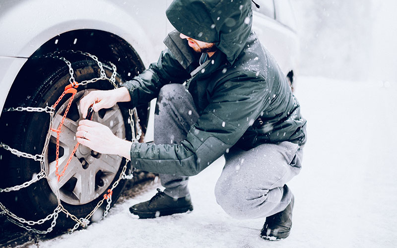 Adding snow chains to tires