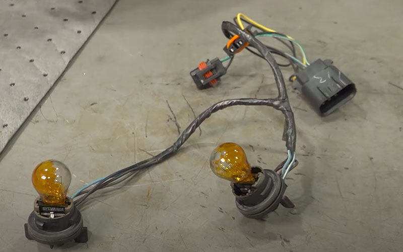 Light bulbs attached to new wiring harness - TRQ on youtube.com