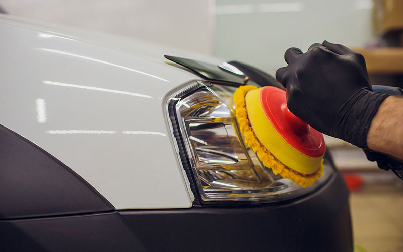Headlight being cleaned Headlight being cleaned
