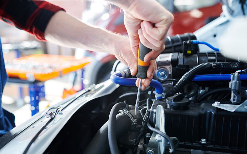 Using a screwdriver under the hood