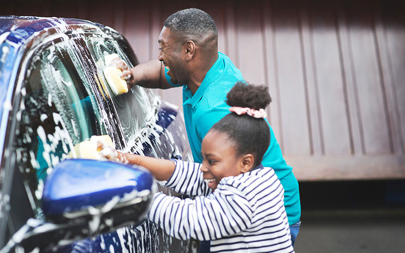 Two people washing a car Two people washing a car