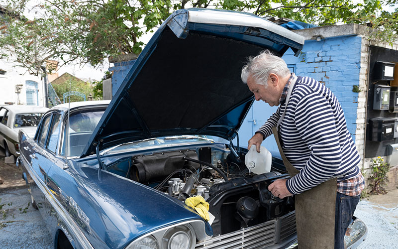 Man maintaining his classic car