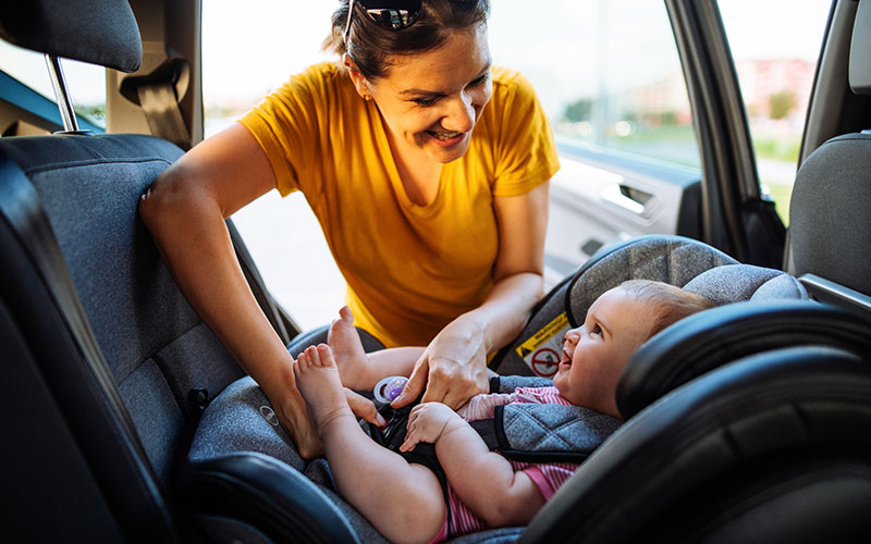 Mom buckling in her baby