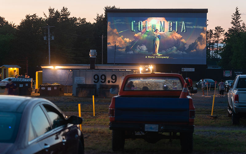 People Enjoying a Drive-In Movie People Enjoying a Drive-In Movie