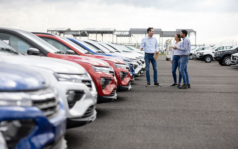 Salesman showing cars Salesman showing cars