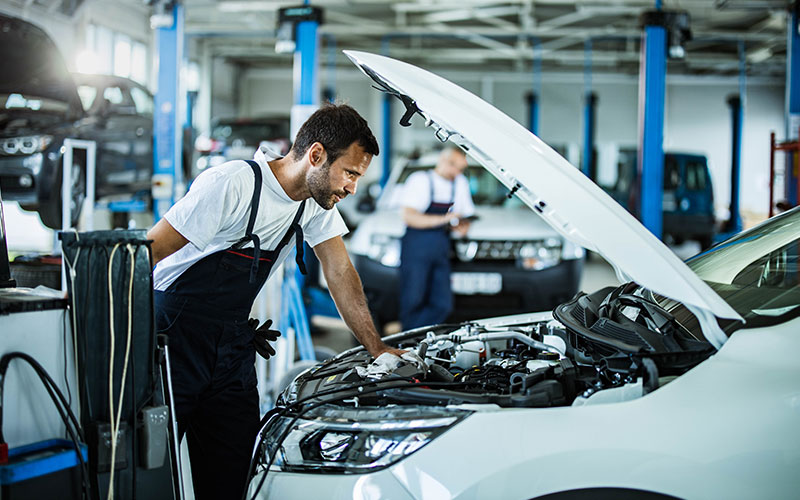 Mechanic analyzing engine problems