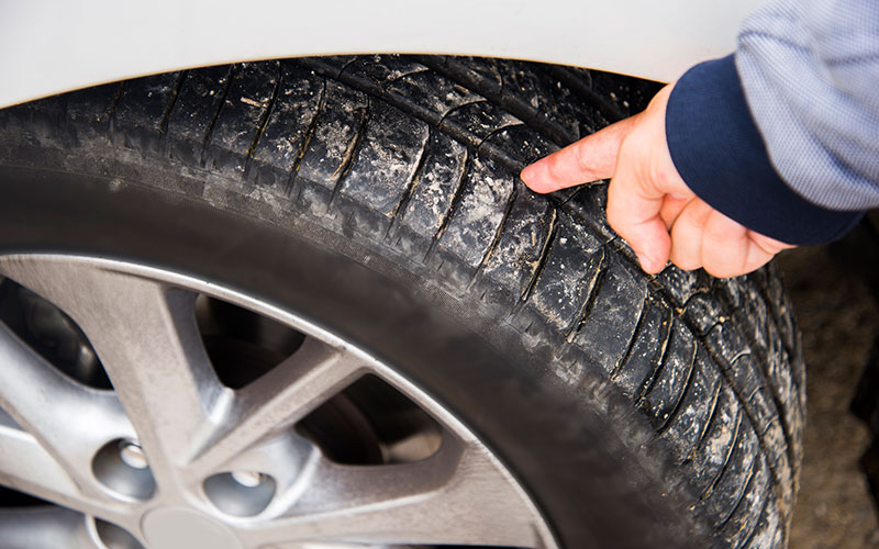 Checking tire tread Checking tire tread