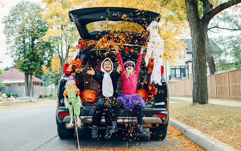 SUV decorated for Trunk or Treat with excited kids