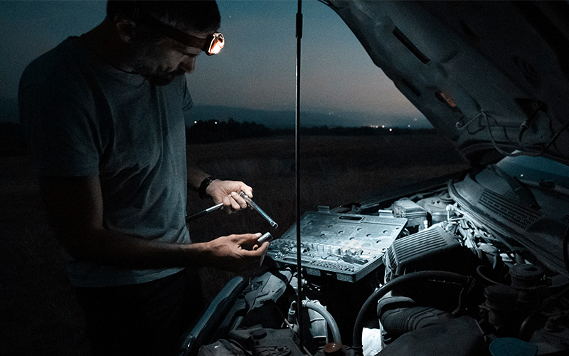 Wearing headlamp while working on car Wearing headlamp while working on car