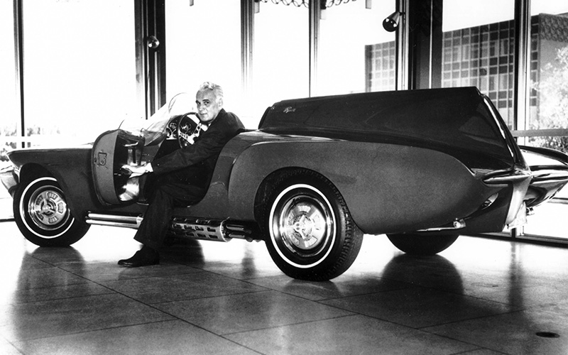 Virgil Exner with the 1960 Plymouth XNR concept car - media.stellantisnorthamerica.com Virgil Exner with the 1960 Plymouth XNR concept car - media.stellantisnorthamerica.com