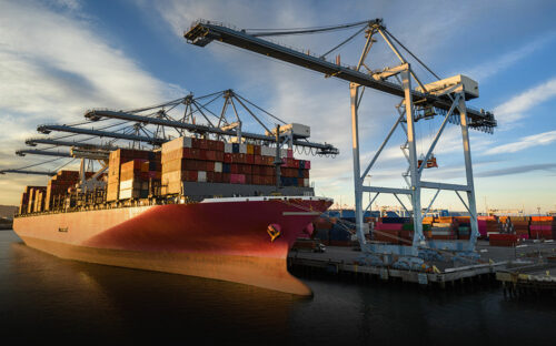 Docked cargo ship loaded with containers