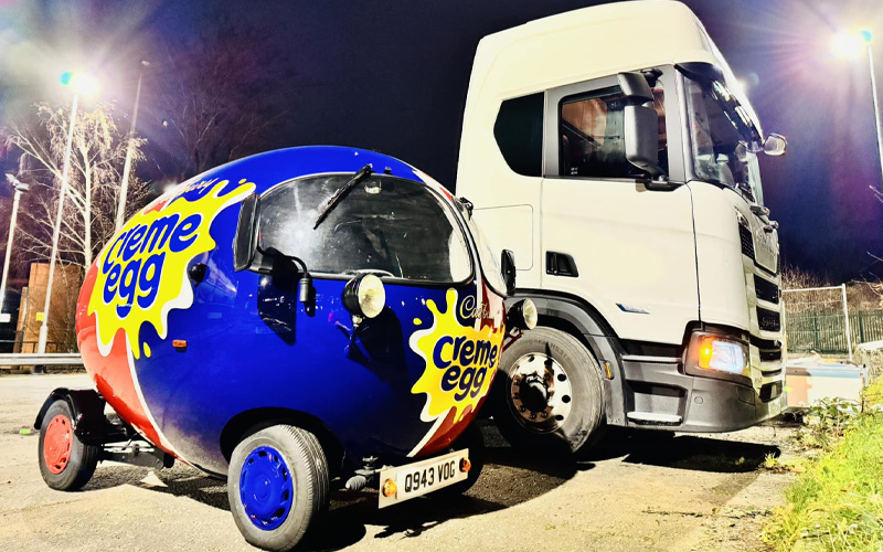 Cadbury Creme Egg car next to a semi truck - Chris Phillips on Facebook