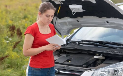 Woman reading owners manual