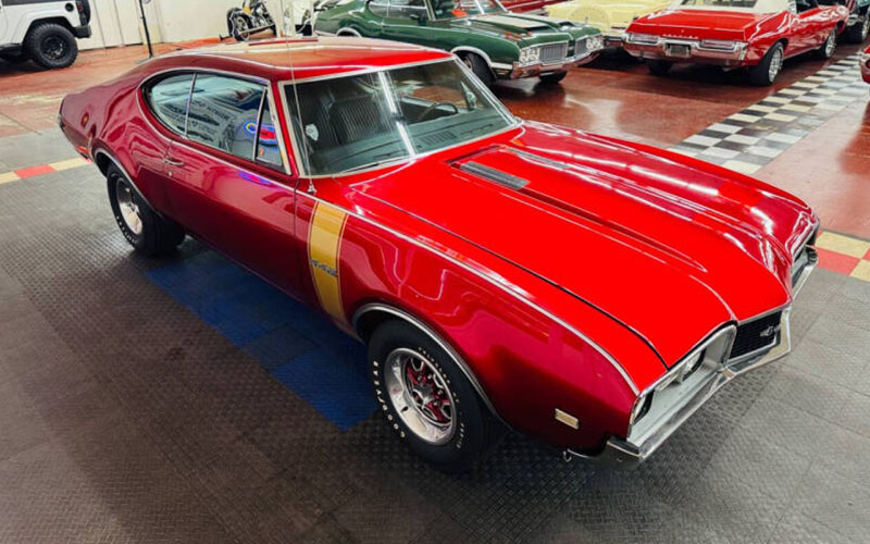 A red and gold 1968 Oldsmobile 442