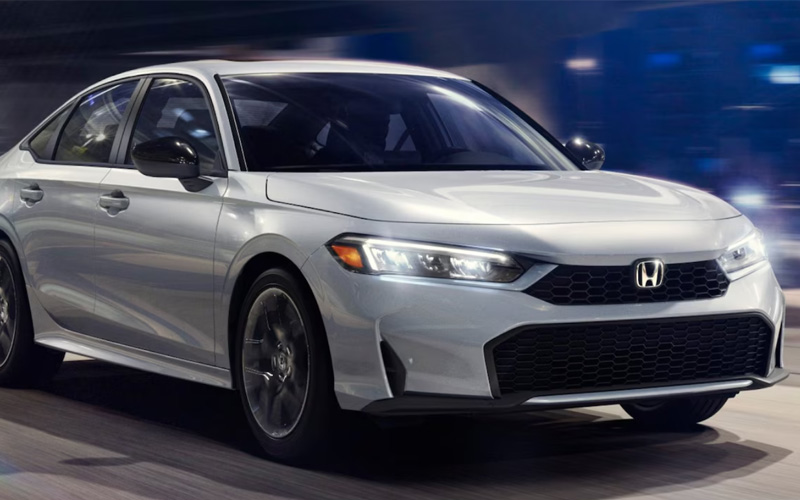 Silver Honda Civic driving on the street