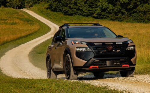 2026 Nissan Rogue driving down a dirt path