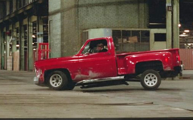 A red 1973 Chevrolet C-10 Stepside during a car chase in the movie "The Driver"