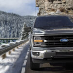 A 2025 Ford F-150 on a mountain highway