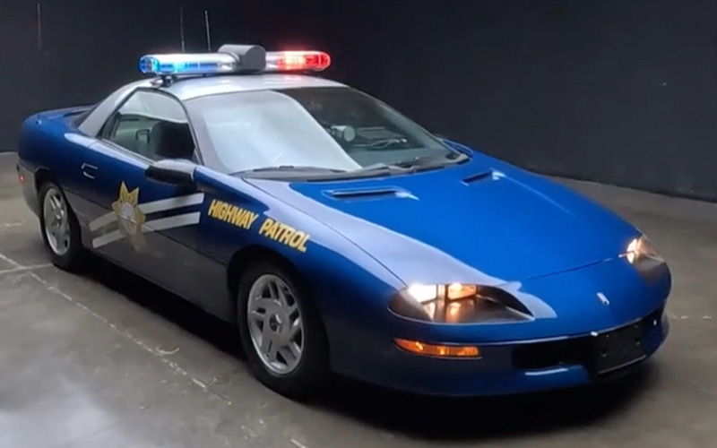 A blue 1995 Chevrolet Camaro B4C Florida Highway Patrol car
