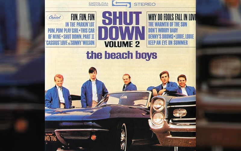 A blue 1963 Chevy Corvette and 1964 Pontiac Grand Prix on The Beach Boys' Shut Down Volume 2 album cover