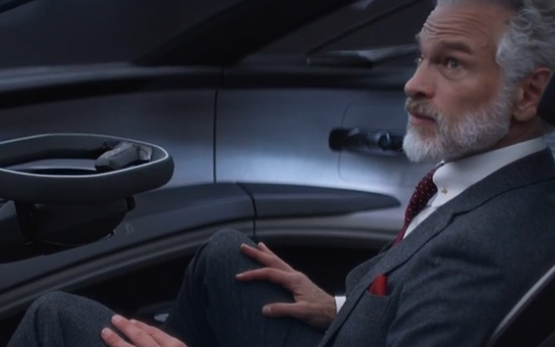 A modern Santa sitting in an Audi concept car