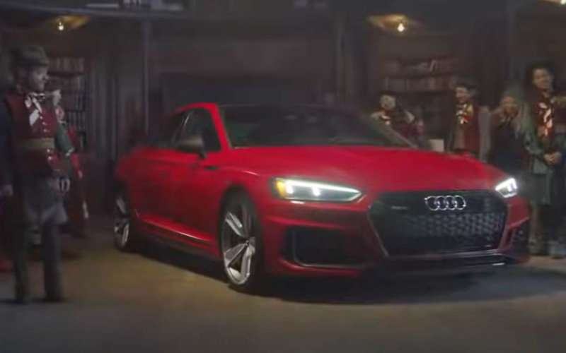 A red Audi from a Christmas car commercial
